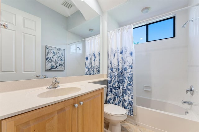 full bath with visible vents, vanity, toilet, tile patterned floors, and shower / bath combo