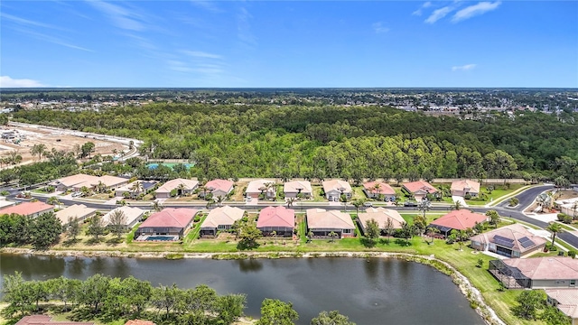 drone / aerial view featuring a water view and a residential view