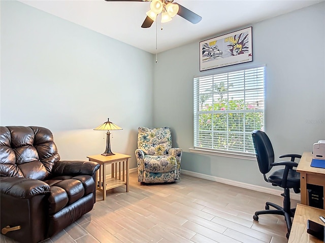 office featuring ceiling fan, wood finished floors, and baseboards