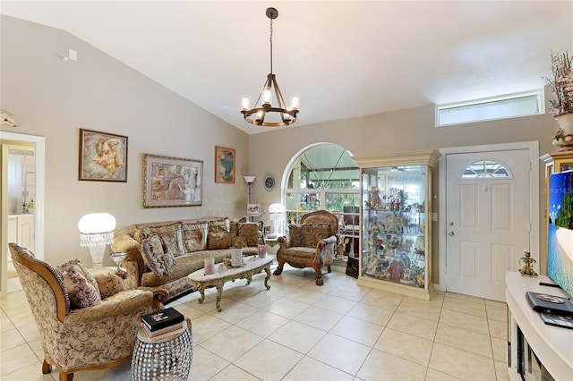 620 Burke Rd, Venice, FL 34293 - living room with an inviting chandelier, high vaulted ceiling, and light tile patterned floors