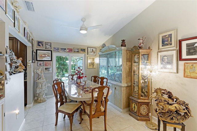620 Burke Rd, Venice, FL 34293 - dining space featuring lofted ceiling, visible vents, a ceiling fan, light tile patterned floors, and baseboards