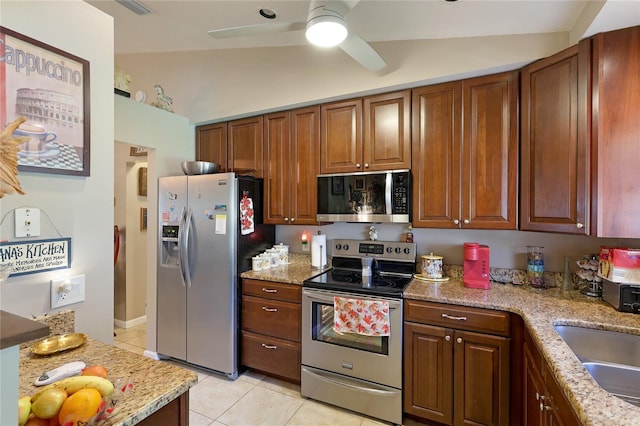 620 Burke Rd, Venice, FL 34293 - kitchen with a sink, light stone counters, ceiling fan, light tile patterned floors, and appliances with stainless steel finishes