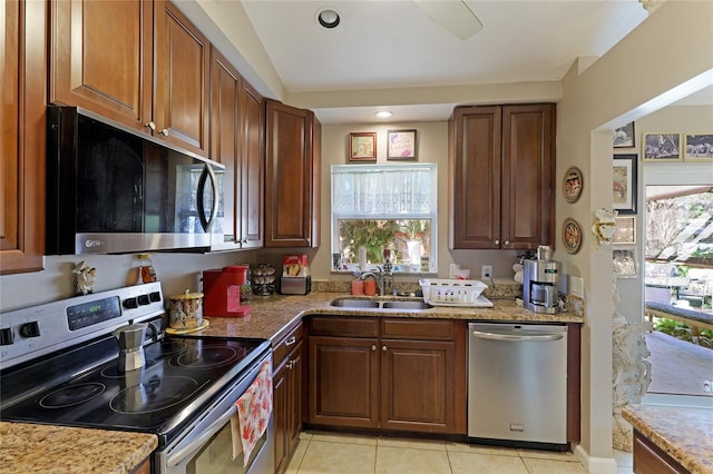 620 Burke Rd, Venice, FL 34293 - kitchen featuring a wealth of natural light, stainless steel appliances, light tile patterned floors, and a sink
