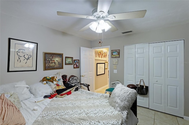 620 Burke Rd, Venice, FL 34293 - bedroom with a closet, visible vents, baseboards, ceiling fan, and light tile patterned flooring