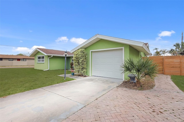 single story home featuring fence, stucco siding, driveway, and a front yard