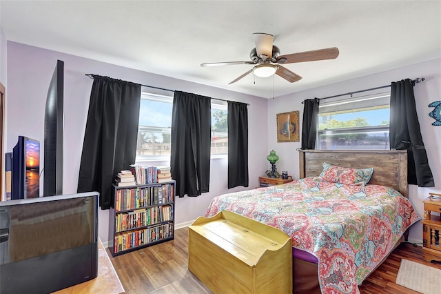 bedroom with a ceiling fan and wood finished floors
