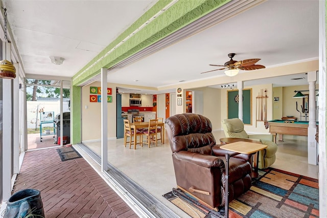 interior space with a ceiling fan, pool table, and baseboards