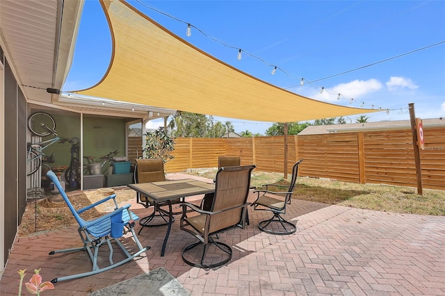 view of patio / terrace with outdoor dining area and a fenced backyard