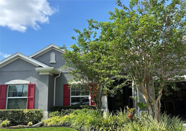 view of side of home featuring stucco siding