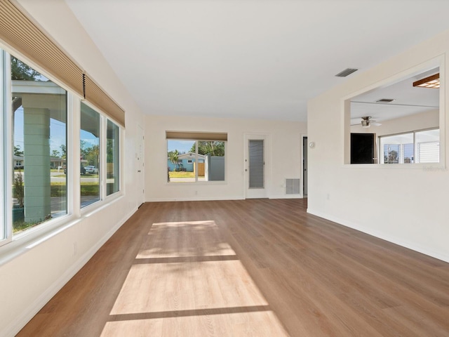 6116 Rodgers Ave, Sarasota, FL 34231 - interior space featuring a ceiling fan, baseboards, visible vents, and wood finished floors