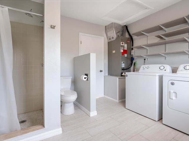 6116 Rodgers Ave, Sarasota, FL 34231 - washroom with baseboards, washer and clothes dryer, and heating unit