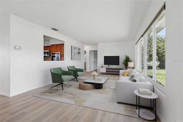6116 Rodgers Ave, Sarasota, FL 34231 - living area featuring wood finished floors and baseboards