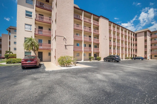 4015 Lake Bayshore Dr Unit 108, Bradenton, FL 34205 - view of property featuring uncovered parking