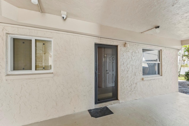 4015 Lake Bayshore Dr Unit 108, Bradenton, FL 34205 - property entrance featuring stucco siding and a patio