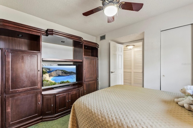 4015 Lake Bayshore Dr Unit 108, Bradenton, FL 34205 - carpeted bedroom featuring a closet, visible vents, and ceiling fan