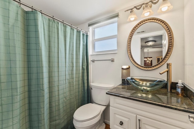 4015 Lake Bayshore Dr Unit 108, Bradenton, FL 34205 - full bathroom featuring vanity, toilet, a shower with curtain, and visible vents
