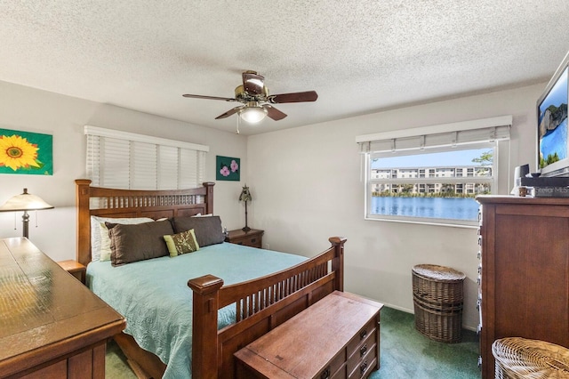 4015 Lake Bayshore Dr Unit 108, Bradenton, FL 34205 - carpeted bedroom featuring ceiling fan and a textured ceiling