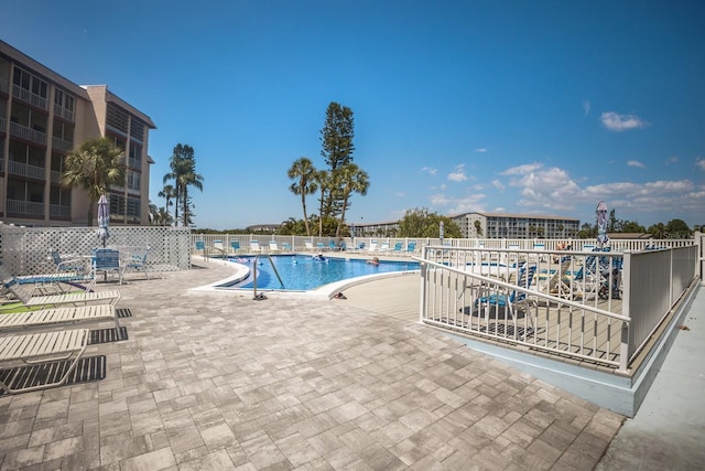 4015 Lake Bayshore Dr Unit 108, Bradenton, FL 34205 - community pool featuring fence and a patio