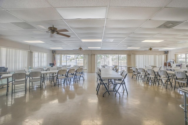 4015 Lake Bayshore Dr Unit 108, Bradenton, FL 34205 - dining room with ceiling fan, concrete flooring, and a drop ceiling
