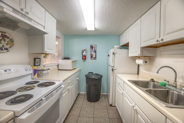 4015 Lake Bayshore Dr Unit 108, Bradenton, FL 34205 - kitchen featuring a sink, a textured ceiling, white cabinetry, white appliances, and under cabinet range hood