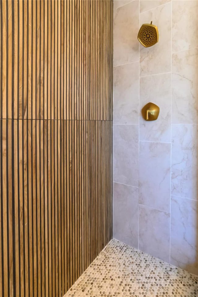 bathroom with tiled shower
