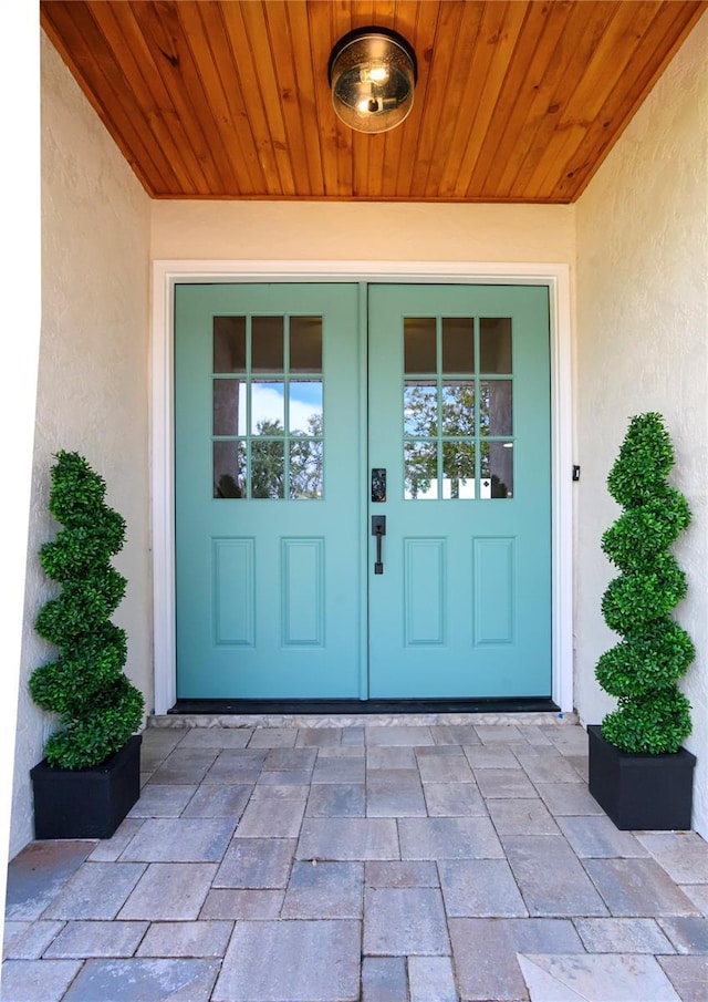 doorway to property with stucco siding