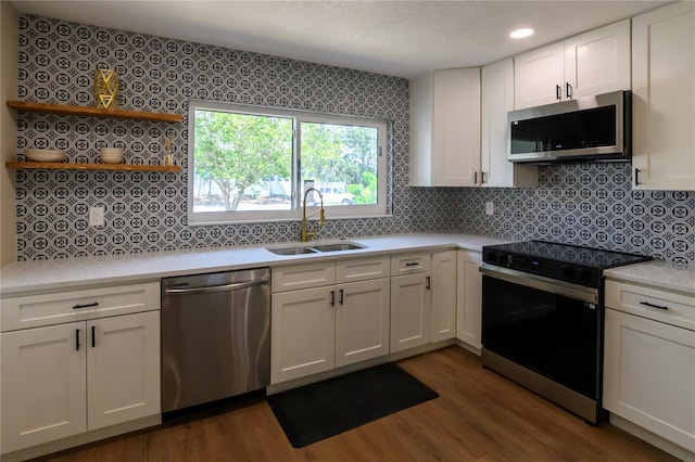 kitchen featuring white cabinetry, appliances with stainless steel finishes, and a sink