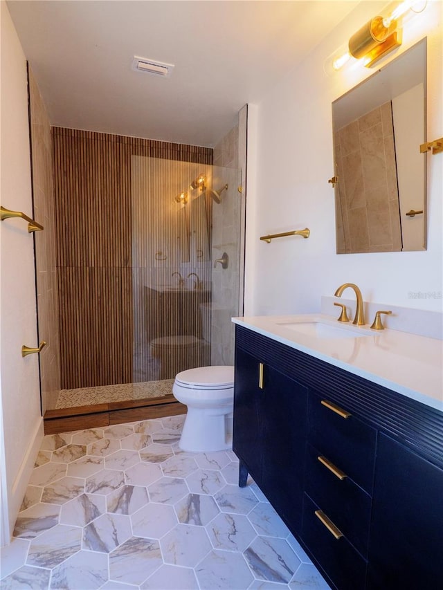 full bath with visible vents, a stall shower, toilet, and vanity