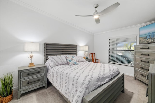 bedroom featuring crown molding, a ceiling fan, baseboards, and light carpet