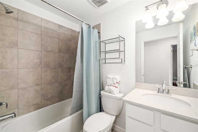 bathroom featuring visible vents, shower / tub combo with curtain, vanity, toilet, and a chandelier