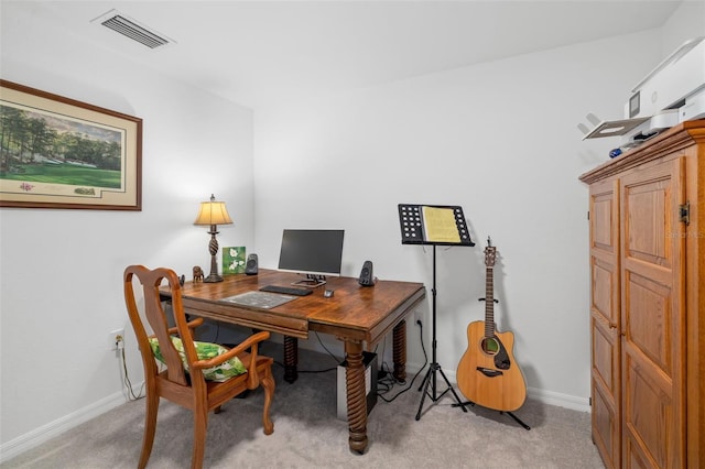 office space with baseboards, light carpet, and visible vents
