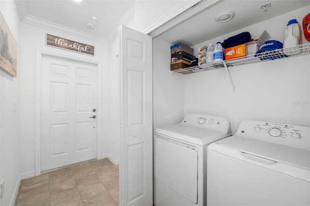 washroom featuring crown molding, baseboards, laundry area, and independent washer and dryer