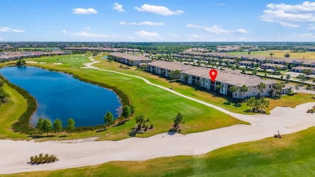 bird's eye view featuring a residential view, view of golf course, and a water view
