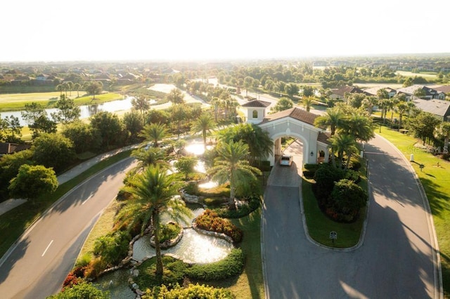 birds eye view of property with a water view and a residential view