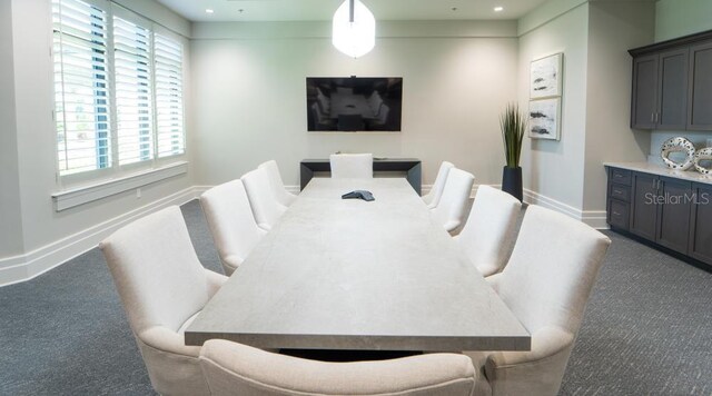 carpeted dining space with a healthy amount of sunlight, baseboards, and recessed lighting