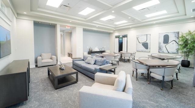 carpeted living area with a towering ceiling, recessed lighting, and visible vents