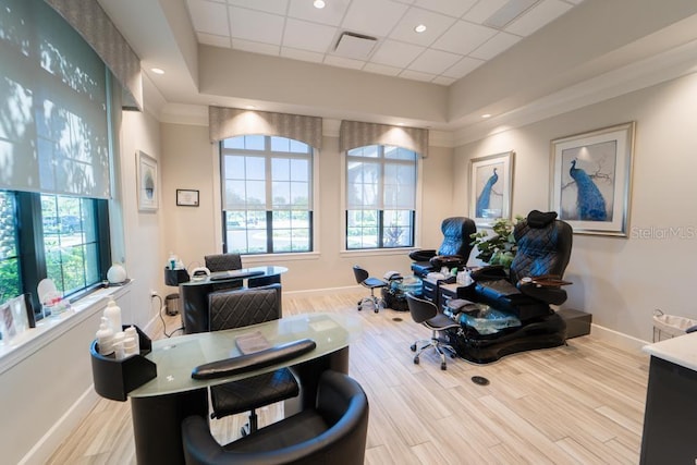 office space featuring baseboards, plenty of natural light, and wood finished floors