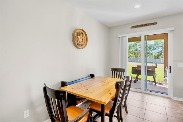 dining space with baseboards, recessed lighting, and light tile patterned floors