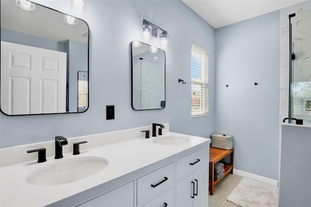 full bath featuring a sink, tile patterned floors, an enclosed shower, and double vanity