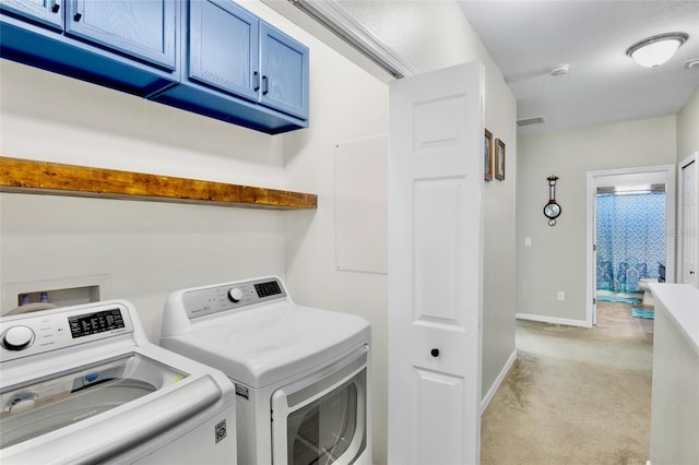 laundry area with laundry area, visible vents, light colored carpet, baseboards, and washer and clothes dryer