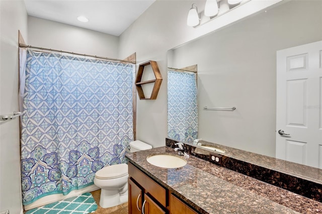 bathroom featuring toilet, a shower with curtain, and vanity