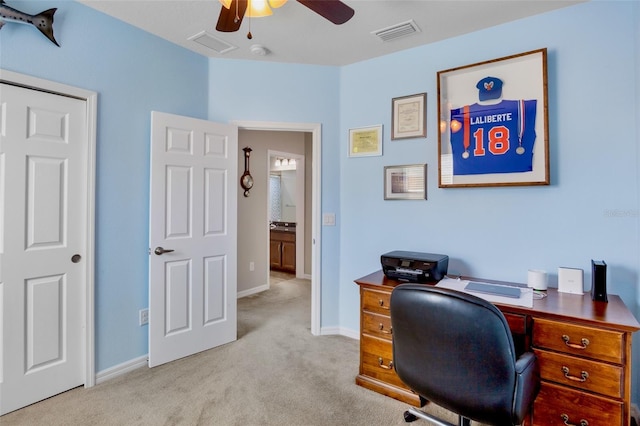 home office with baseboards, ceiling fan, carpet, and visible vents