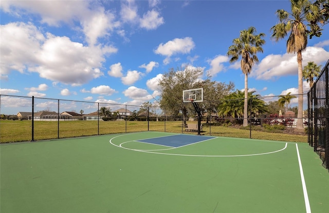 view of basketball court with fence and community basketball court