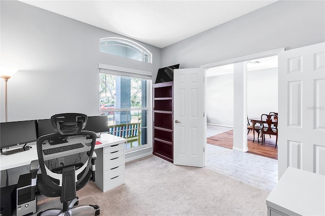 6617 Cheswick St, Sarasota, FL 34243 - home office featuring light tile patterned flooring and light colored carpet