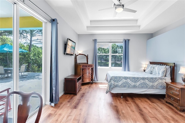 6617 Cheswick St, Sarasota, FL 34243 - bedroom with access to outside, a raised ceiling, light wood finished floors, and ceiling fan