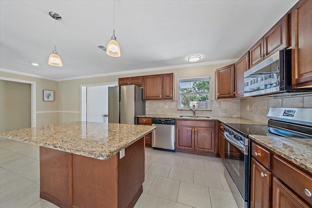 kitchen with a sink, appliances with stainless steel finishes, crown molding, and visible vents