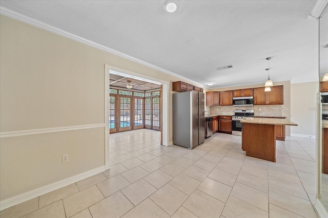 kitchen with backsplash, crown molding, appliances with stainless steel finishes, baseboards, and light tile patterned flooring