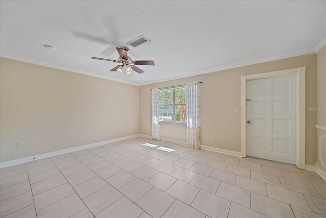 spare room featuring visible vents, a ceiling fan, baseboards, and ornamental molding