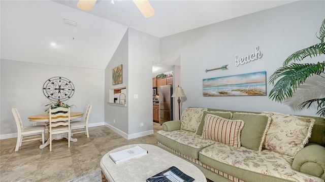 living area featuring visible vents, baseboards, a ceiling fan, and high vaulted ceiling