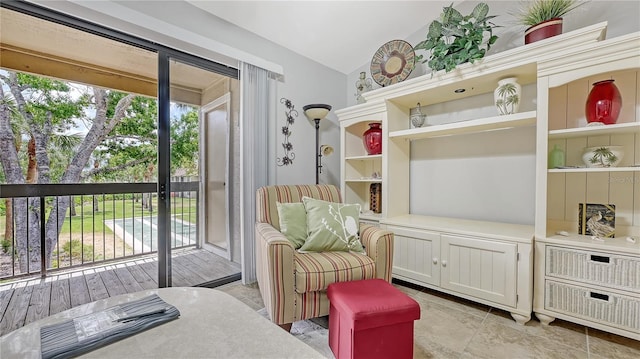sitting room with vaulted ceiling